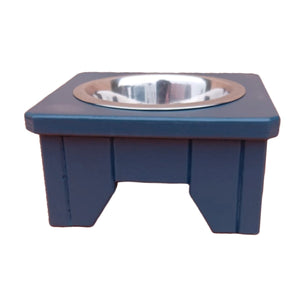 Hague Blue Handmade Elevated Wooden dog bowl stand with a metal bowl on a white background