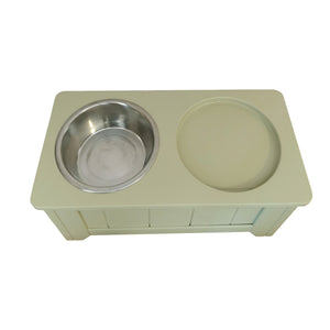 handmade raised wooden enrichment stand painted in farrow and ball shade ball green with a space for an enrichment feeding bowl and a stainless steel water bowl