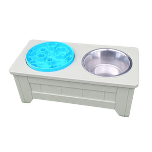 handmade raised wooden enrichment stand painted in farrow and ball shade ball green with a blue flower enrichment feeding bowl and a stainless steel water  bowl